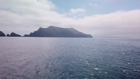 Gimbal-panning-shot-approaching-Anacapa-Island-by-boat-at-the-Channel-Islands-National-Park-off-the-coast-of-California