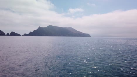 gimbal panning shot approaching anacapa island by boat at the channel islands national park off the coast of california