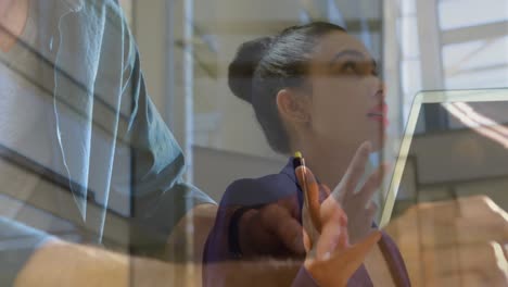 Animation-of-biracial-businesswoman-over-hands-using-laptop