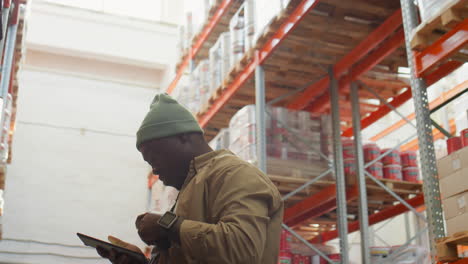 man performing inventory management in a warehouse