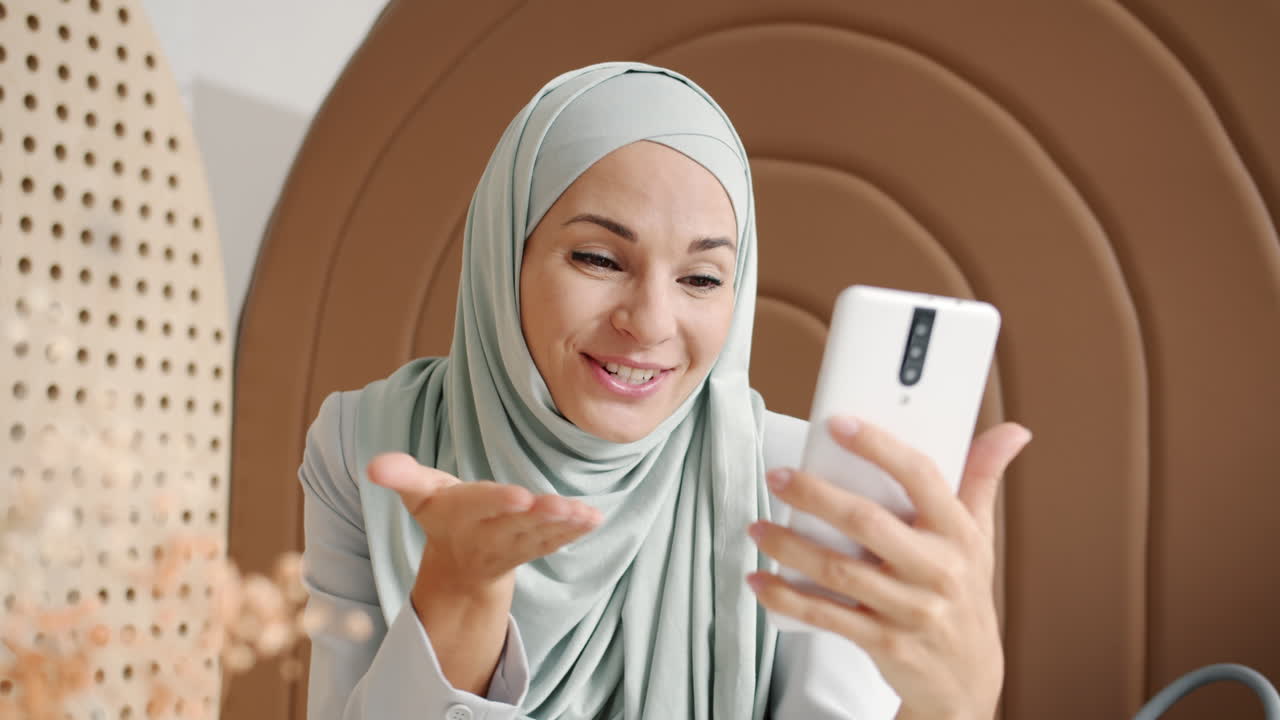 Woman having a video call in a stylish interior