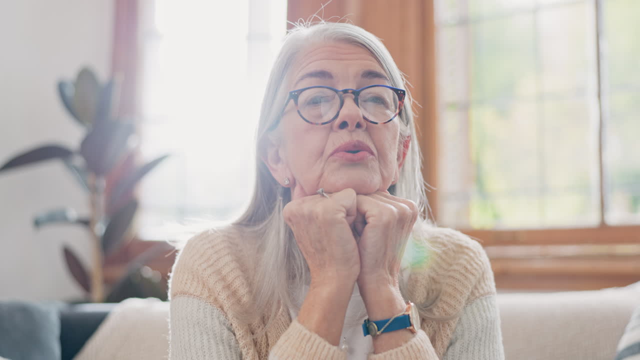 Breathe, calm and senior woman on sofa