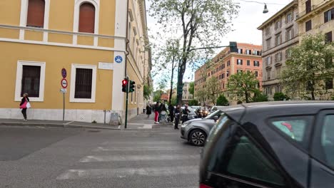 vehicles and pedestrians at a bustling intersection