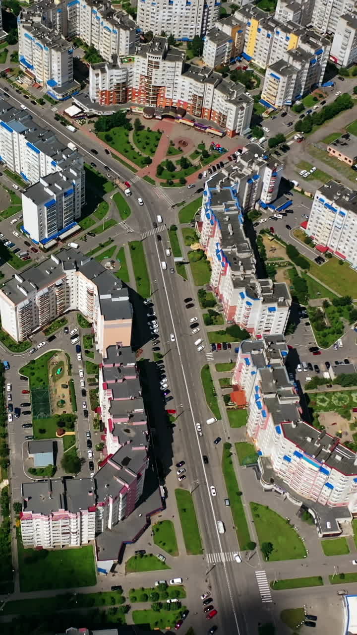 Panoramic view of the city. Modern high-rise buildings in the cityscape. New architectures in the urban district. Aerial view. Vertical video