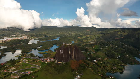 drone shot overlooking the rock of guatape in sunny antioquia, colombia