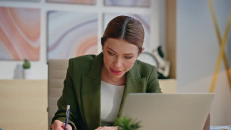 nervous businesswoman complaining online meeting sitting company office closeup