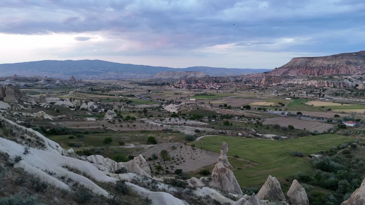 Cappadocia's scenic landscape at dusk, offering tranquility and history
