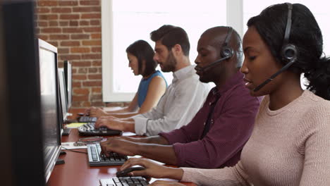 Staff-At-Desks-In-Customer-Service-Department-Shot-On-R3D