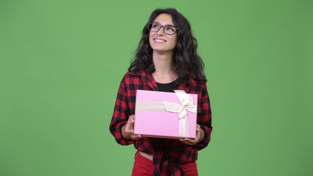 Young beautiful businesswoman with gift box