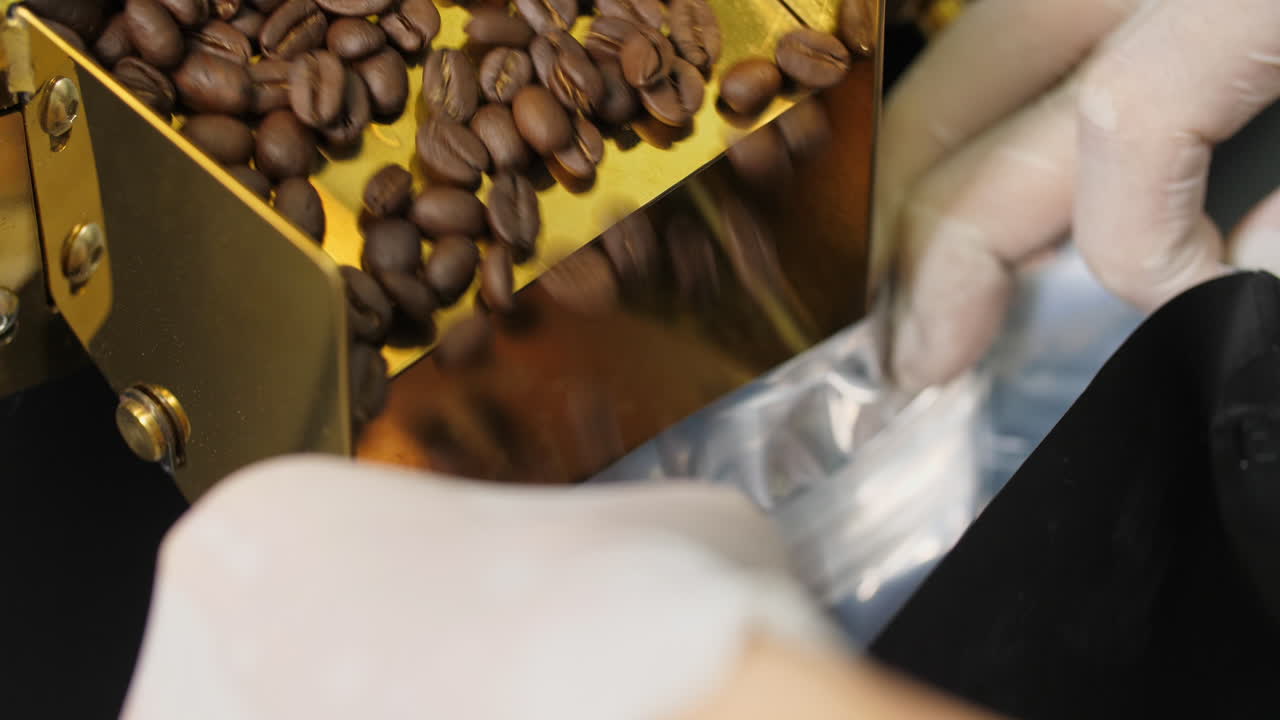 Asian Man Working With Roaster Machine