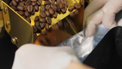 asian man working with roaster machine