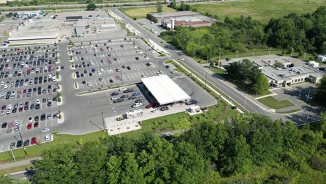 Costco-wholesale-gasoline-pumping-station-drone-high-angle-aerial,-petrol-gas