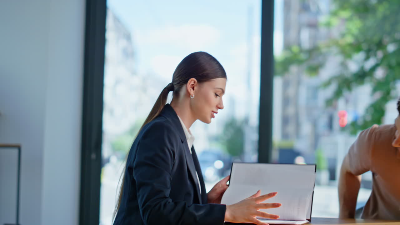Friendly businesswoman meeting client in office closeup. Two business partners