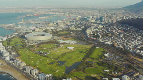 aerial view of cape town cityscape, stadium, and golf course