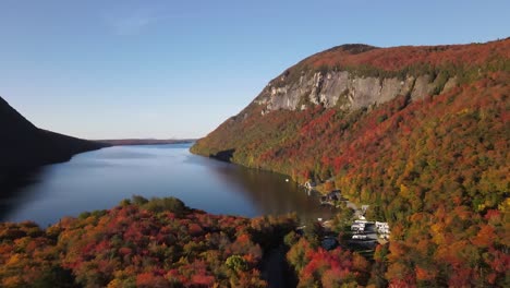 Beautiful-aerial-drone-footage-of-the-fall-leaves-on-and-around-Mount-Hor,-Mount-Pisgah,-and-Lake-Willoughby-during-peak-autumn-foliage-at-Willoughby-State-forest-in-Westmore,-Vermont