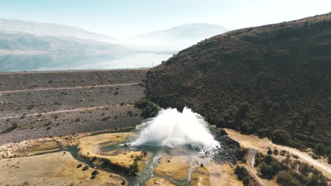 water being forcefully discharged at high pressure from la angostura dam in tafí del valle, argentina