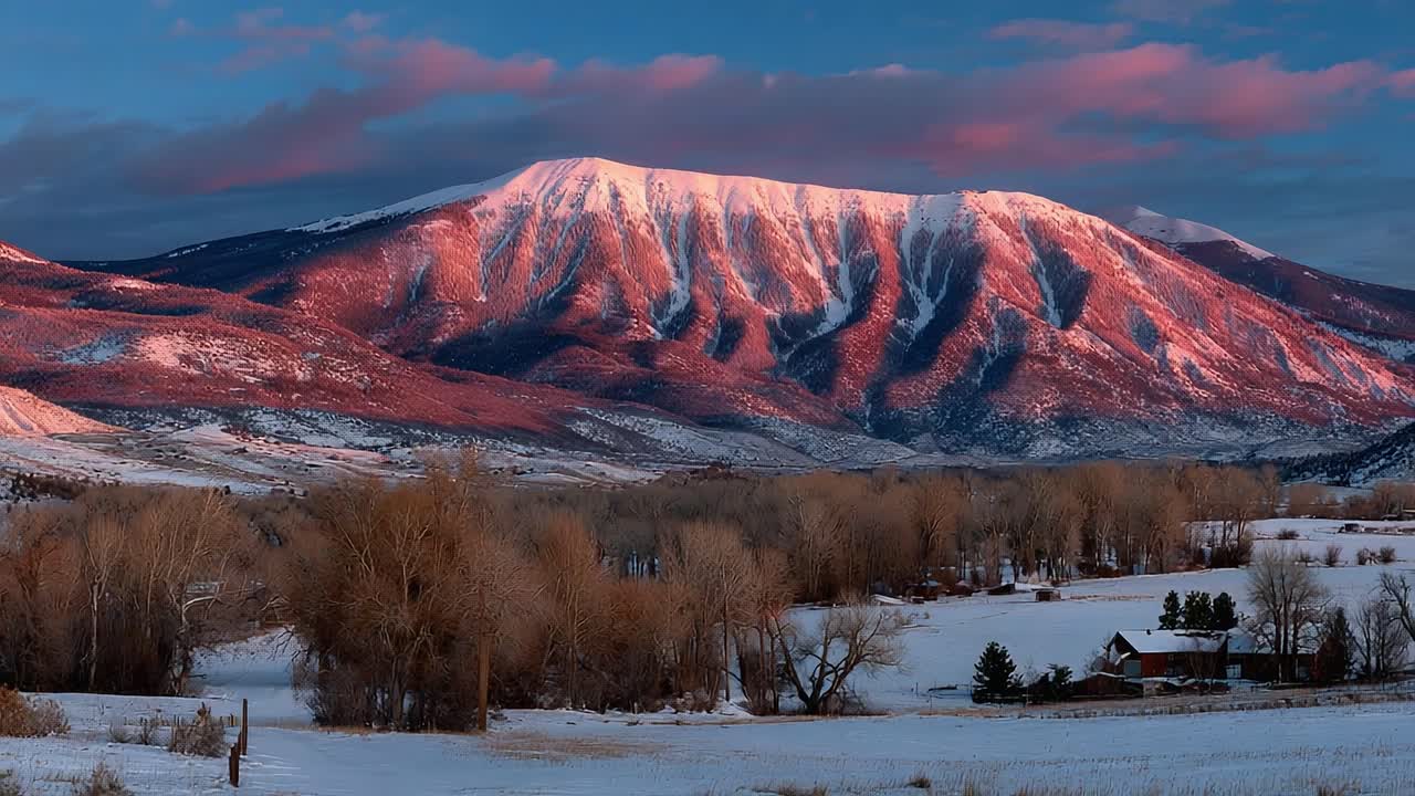 Majestic Mountain Landscape at Dawn: A Serene View of Majestic Peaks Bathed in Morning Light Amidst Vibrant Autumn Foliage and Lush Snow-Covered Ground