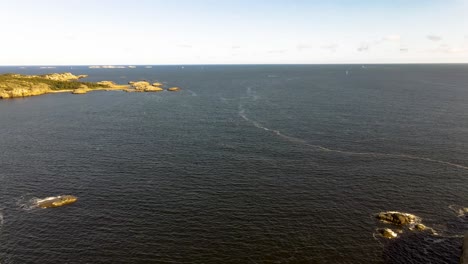 Sailboats-sailing-in-the-distance-on-a-beautiful-Norwegian-summer-day