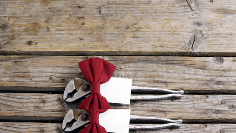 decorated plier and vintage work tools on wooden plank