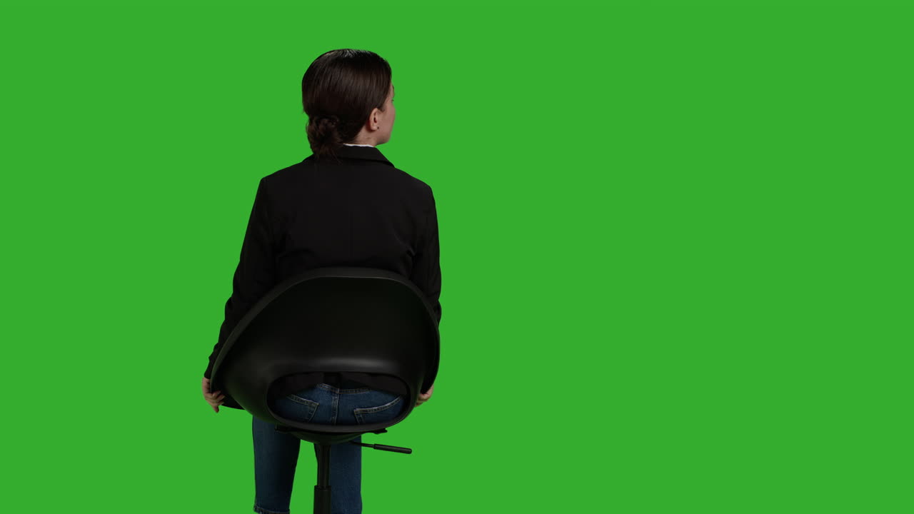 Woman Sitting on a Chair on Green Screen