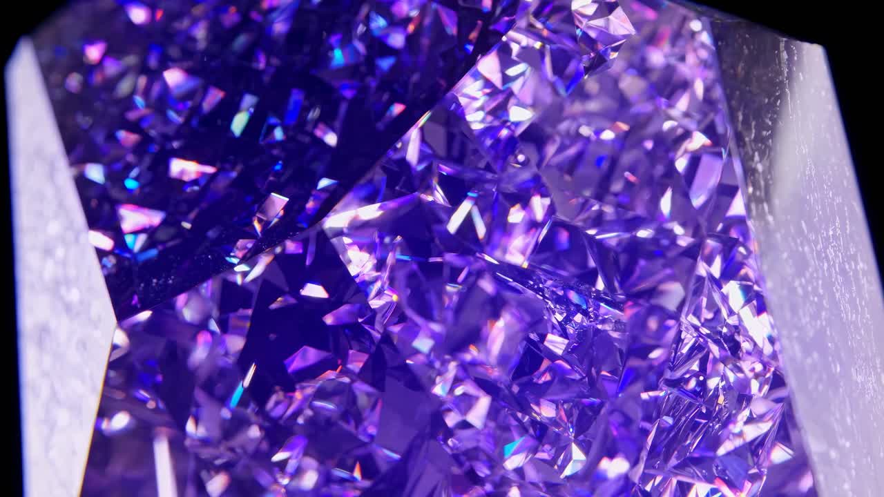 Close-up video of sparkling purple crystals, capturing intricate details and reflections