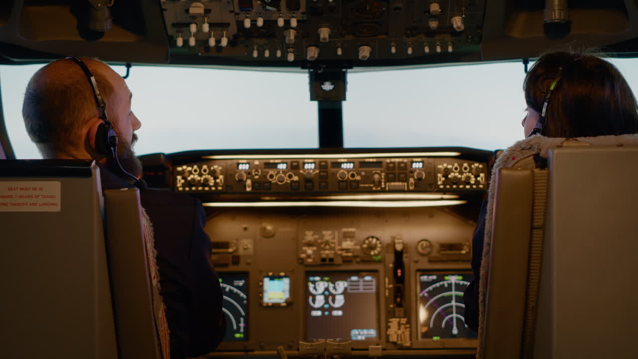 Team of aviators using dashboard buttons to takeoff with plane