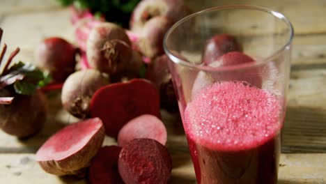 radish with radish juice on wooden table 4k