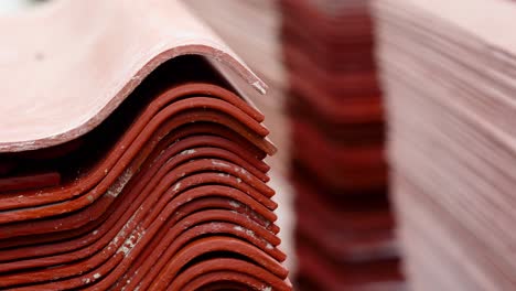 stacked red roofing tiles