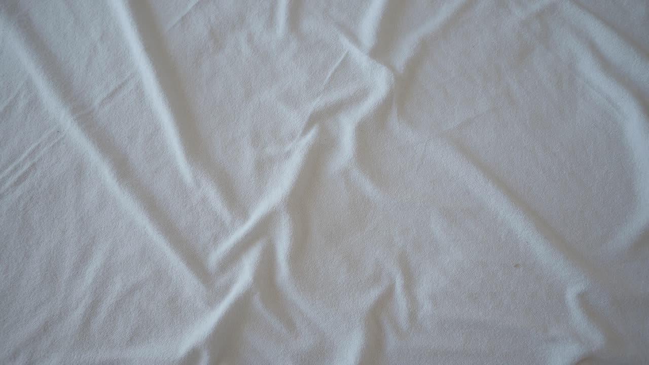 Wrinkled White Bed Sheet