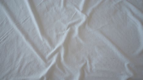 wrinkled white bed sheet