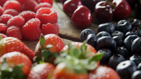 Various-berry-fruits-on-wooden-table-4k