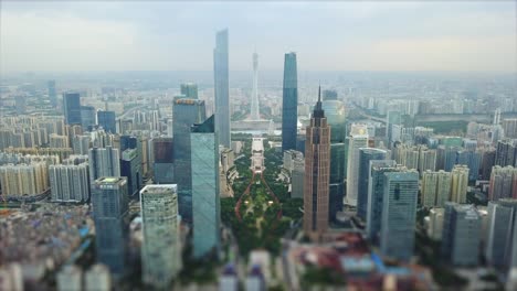 day time storm sky guangzhou city downtown district aerial panorama tilt-shift 4k china