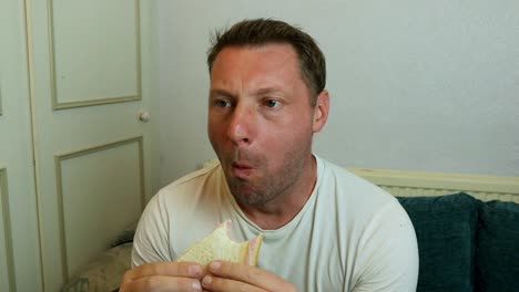 a man eating a sandwich