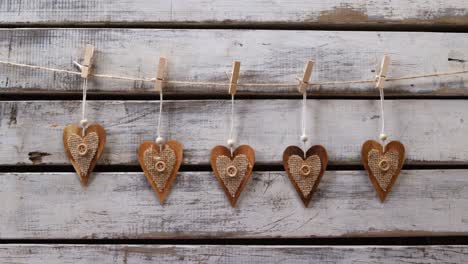 heart shaped decorations pinned on a rope 4k