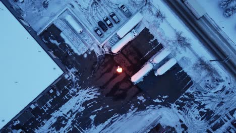 Drone-view-over-open-gas-flames-in-winter,-Alberta,-Canada