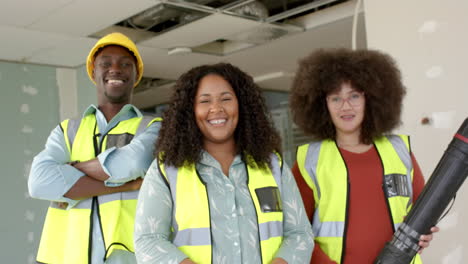 portrait of smiling casual diverse architects working in office, slow motion with copy space