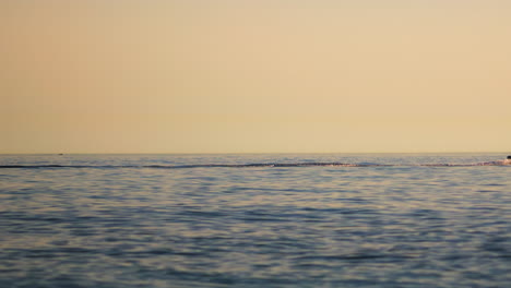 motorboat passing by on the mediterranean sea after sunset