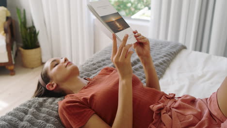 relaxing at home, woman reading book on bed, enjoying peaceful afternoon