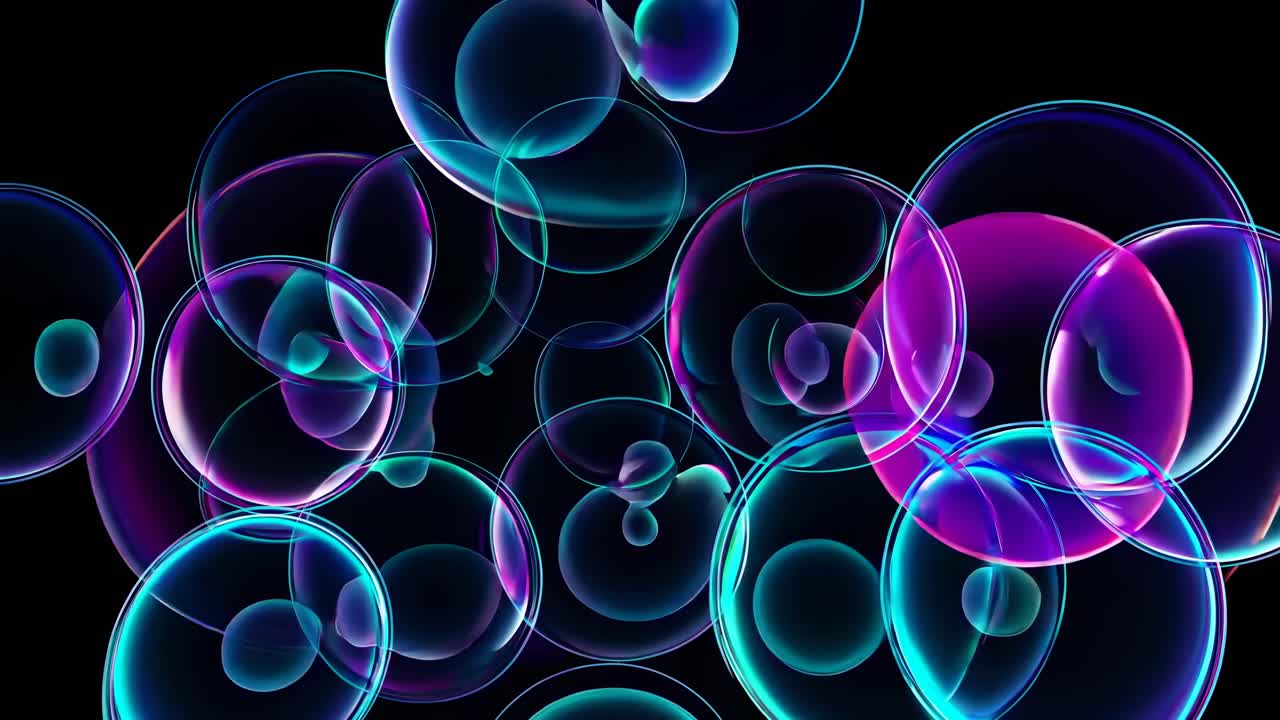 Abstract video of translucent, glowing bubbles overlapping on a black background