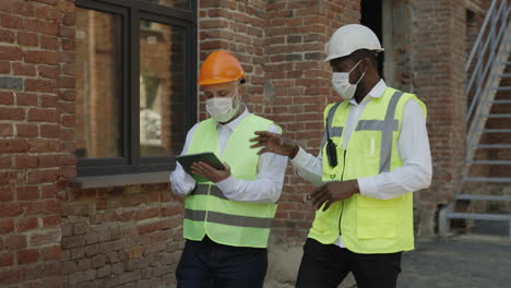 construction workers discussing on a building site