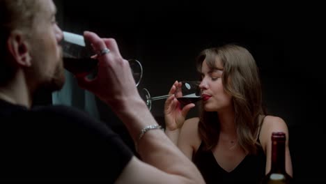 romantic couple enjoying red wine together