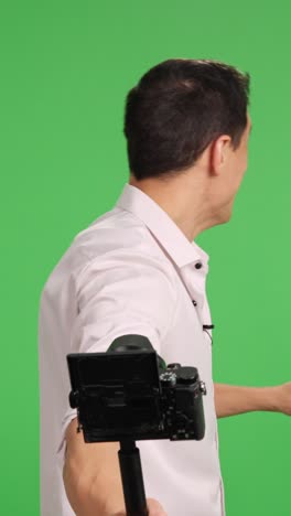 content creator gesturing on green screen background
