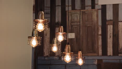 Industrial-design-light-pendants-with-yellow-3200k-LED-lights-in-a-dark-scene