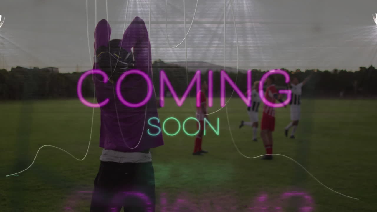 Coming soon text animation over soccer players on field during game