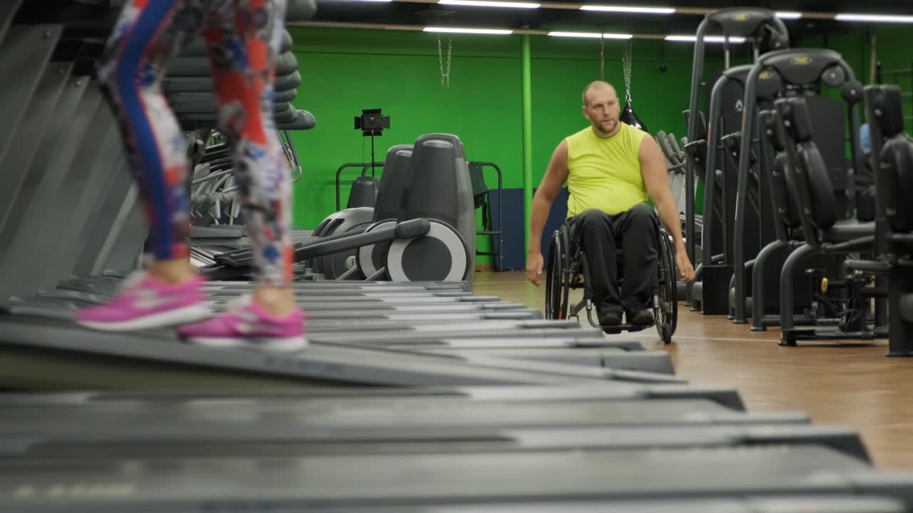 Man with disabilities training in the gym of rehabilitation center