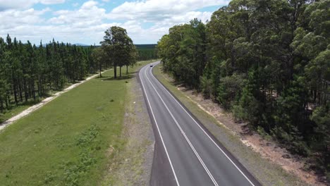 drone descending over a country road