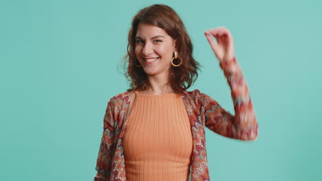 woman pointing down saying to subscribe gesturing ok and like promotional information below
