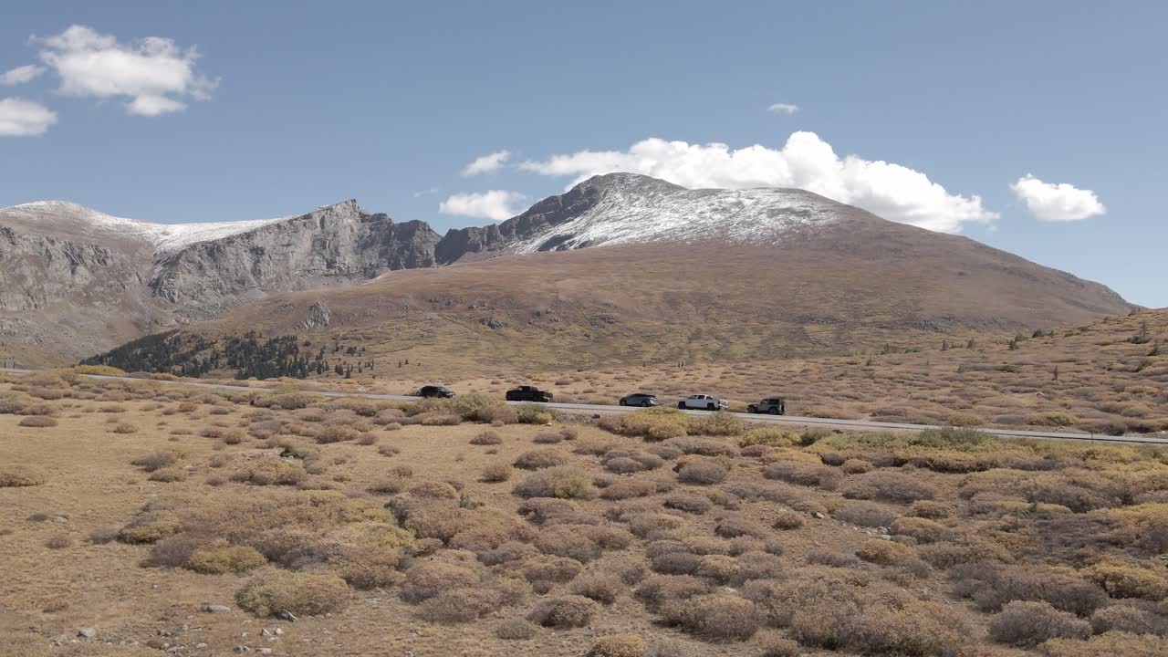 Aerial view of a snow covered Mount Bierstadt and Mount Blue Sky with snow filmed in the fall in the Rocky Mountains of Colorado. Filmed at Guanella Pass with a slow trucking movement.