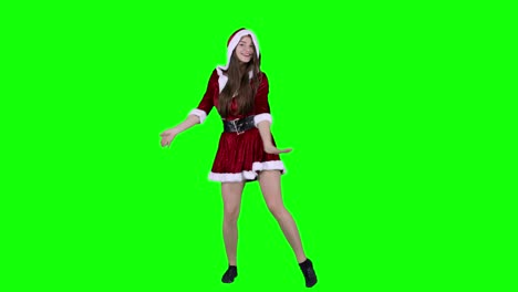 Happy-woman-20s-in-red-dress-Santa-Christmas-dancing-fooling-around-having-fun-expressive-gesticulating-hands-isolated-on-green-screen-background-studio