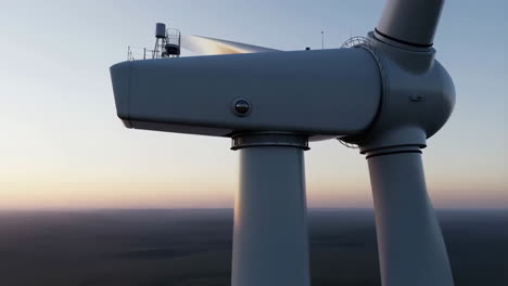 wind turbine generating clean energy at sunset